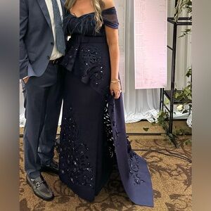 Badgley Mischka marine strapless peplum gown with laser cut details